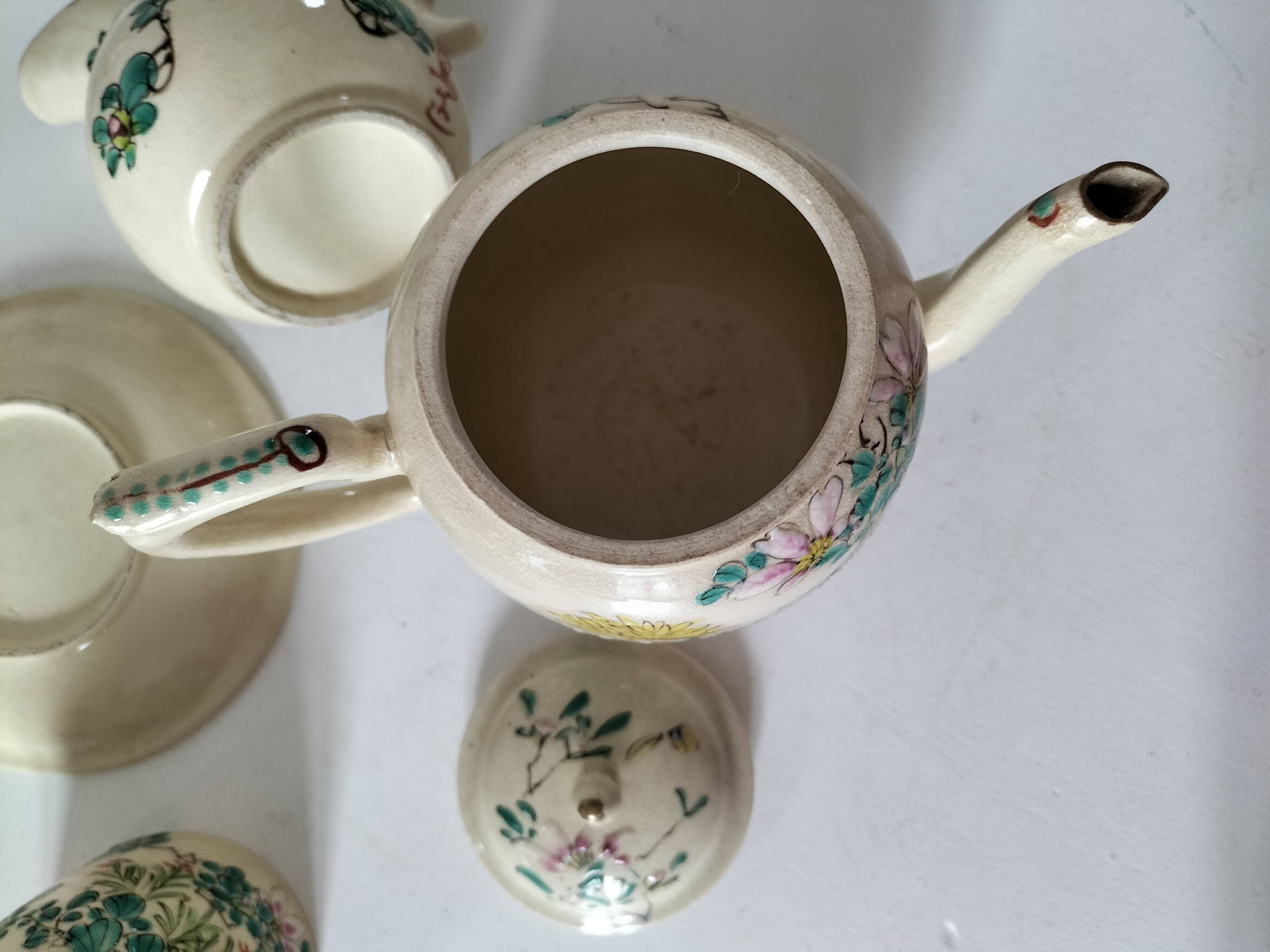 Japanese-style tea set in cracked earthenware with chrysanthemum flowers