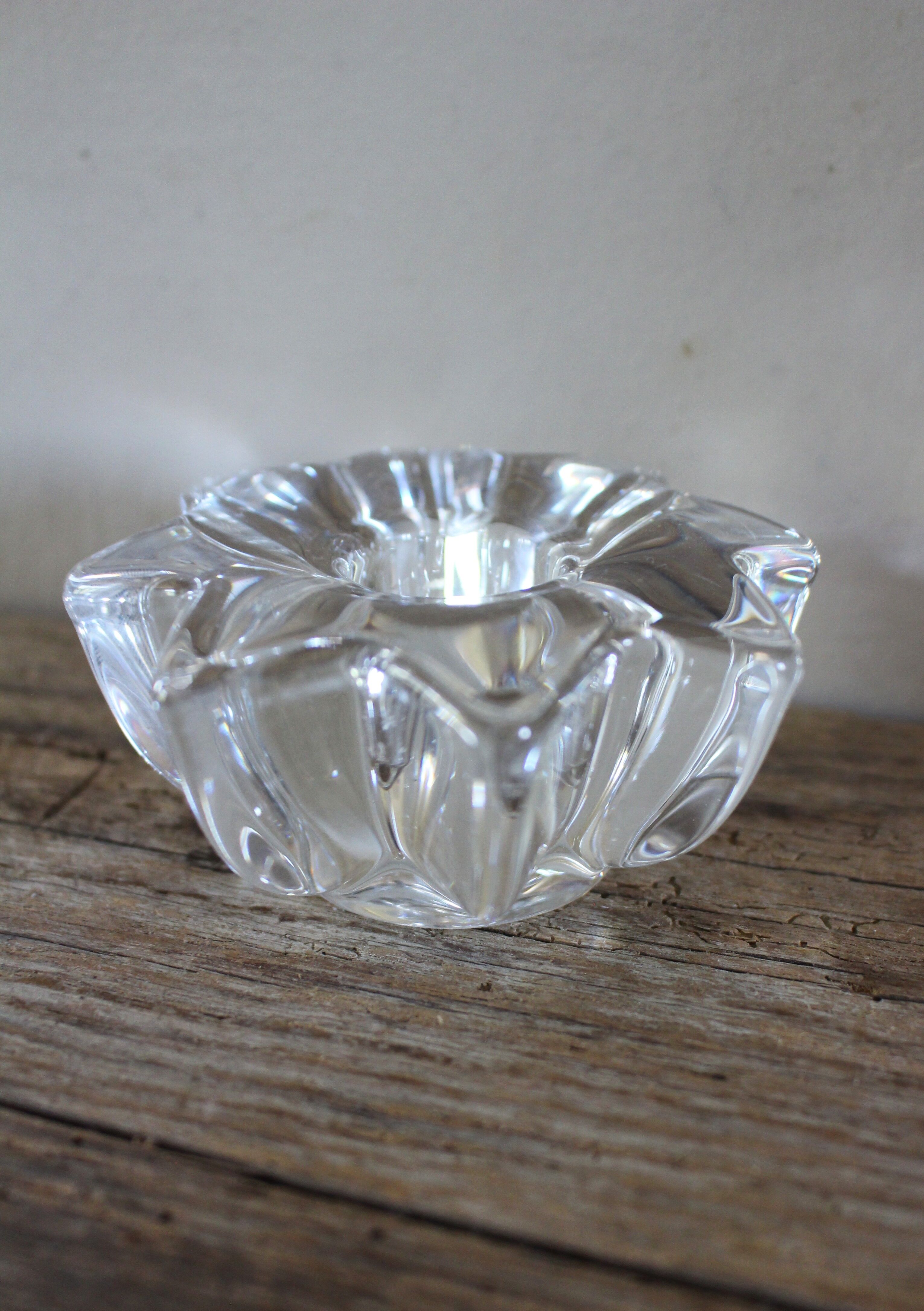 A vintage star flower glass candlestick.