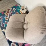 Vintage armchair reupholstered in boucle fabric.