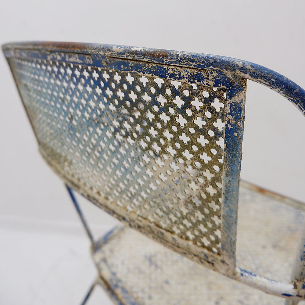 Vintage perforated metal armchair from the 1950s.