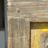 Rectangular Indonesian construction element with blue and yellow plant in carved wood