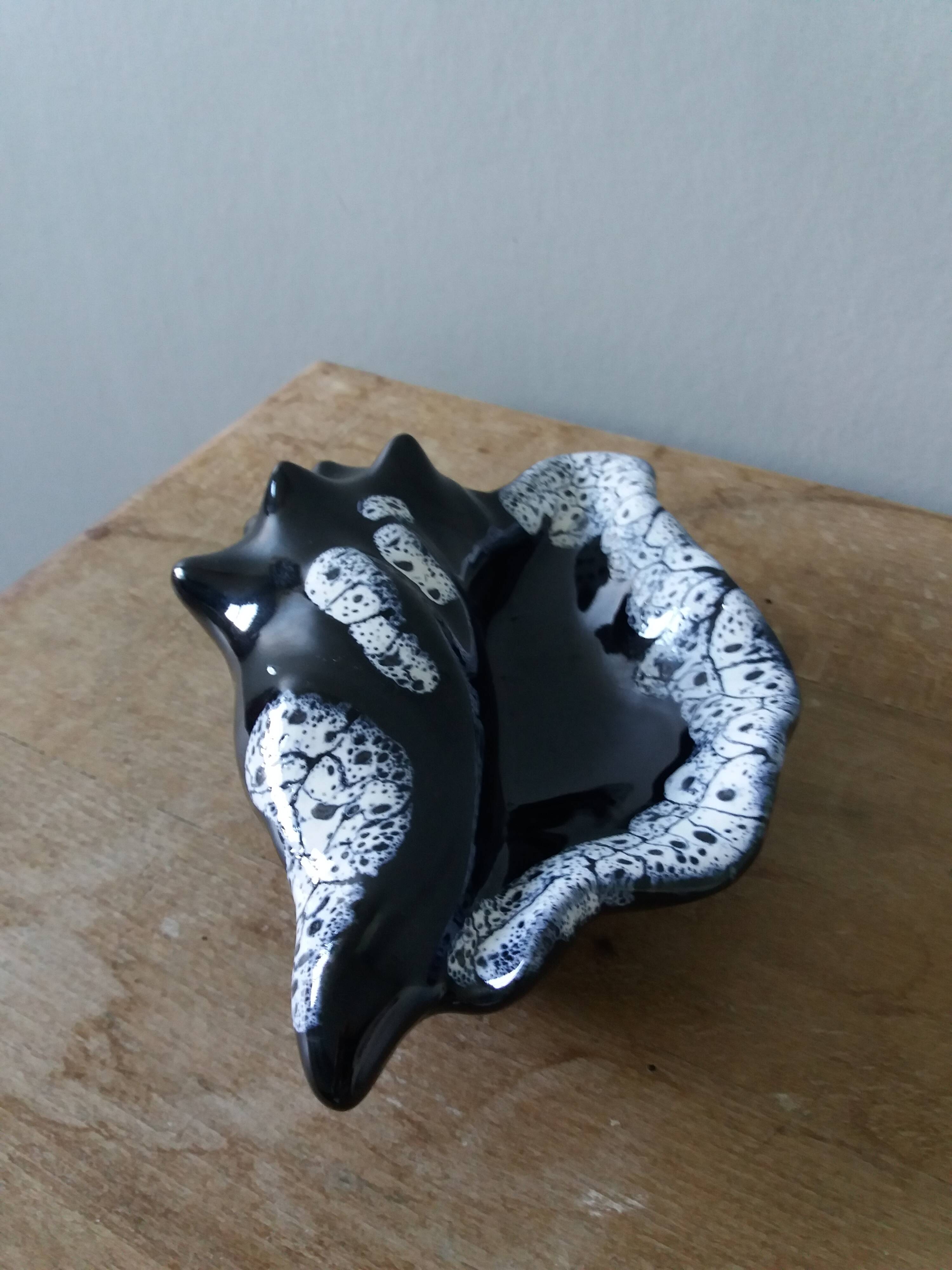 Black ceramic and foam shell ashtray