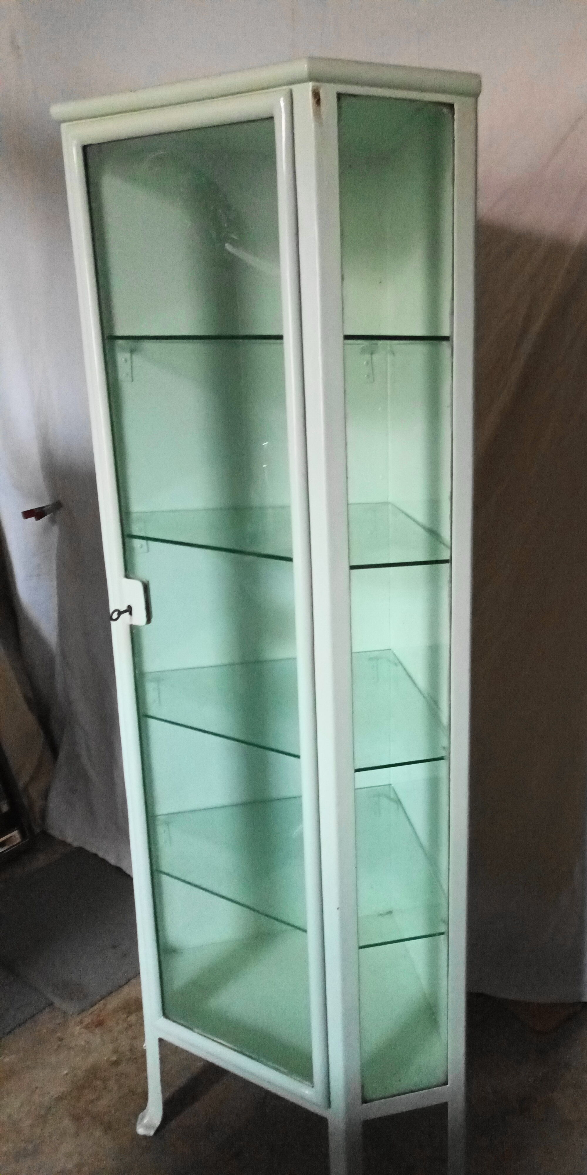 Painted metal ophthalmologist's corner display case, early 20th century