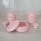 Set of pink and gold ceramic bathroom accessories
