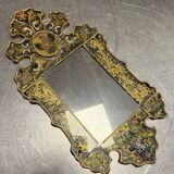 Eglomise glass mirror with scrollwork and branch races decoration