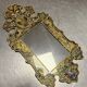 Eglomise glass mirror with scrollwork and branch races decoration
