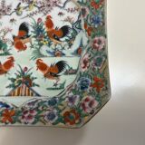 Porcelain plate with several roosters