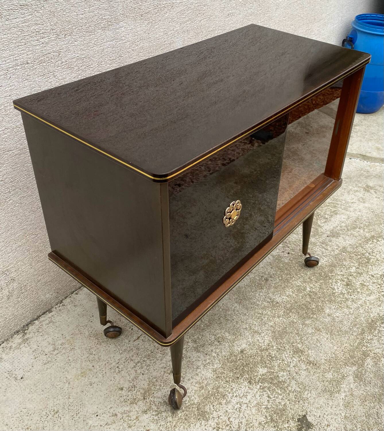Vintage display bar cabinet on wheels from the 60s/70s.