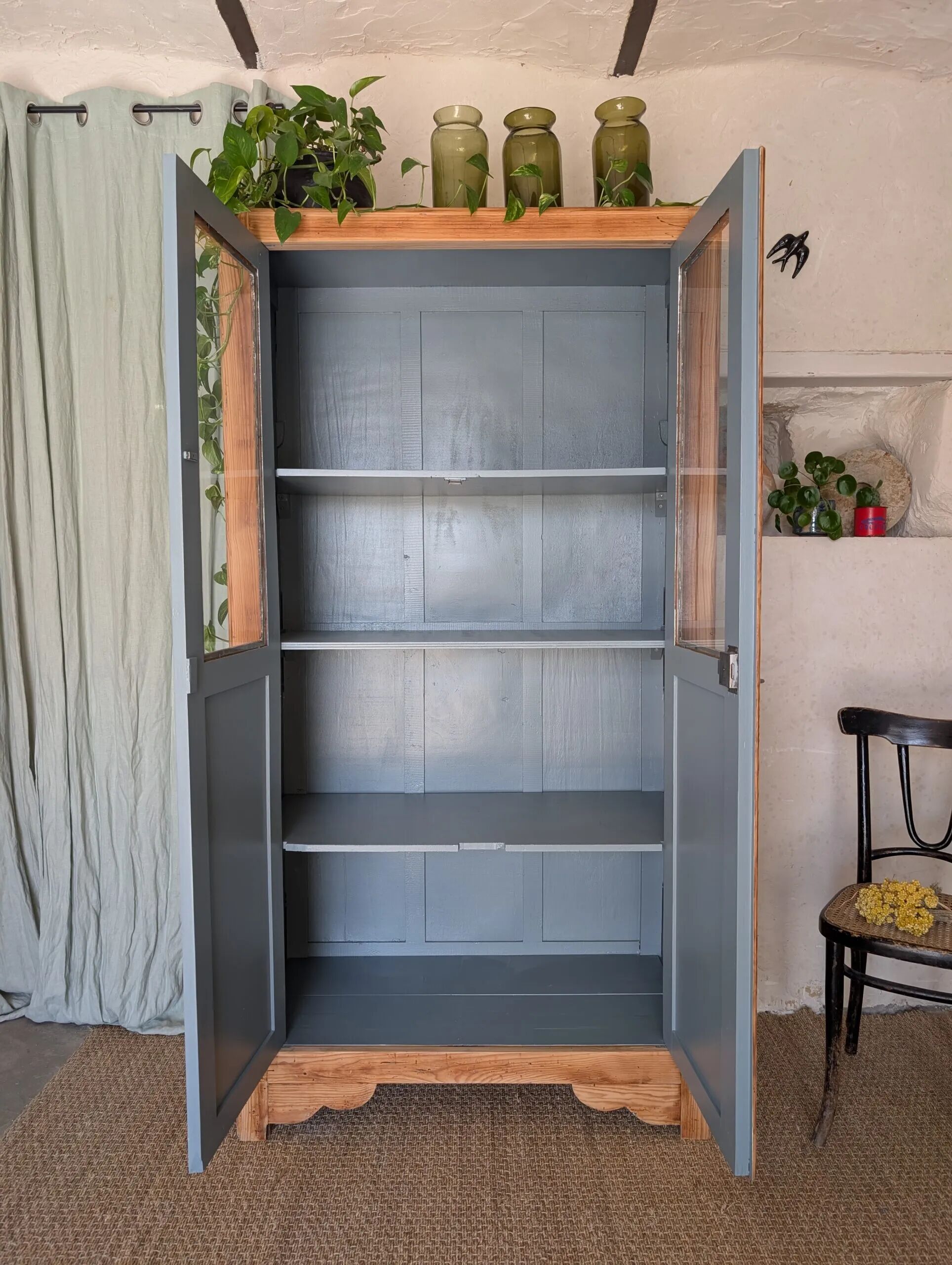 Old glass-fronted wooden library – blue interior