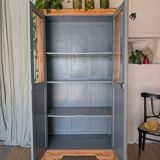 Old glass-fronted wooden library – blue interior