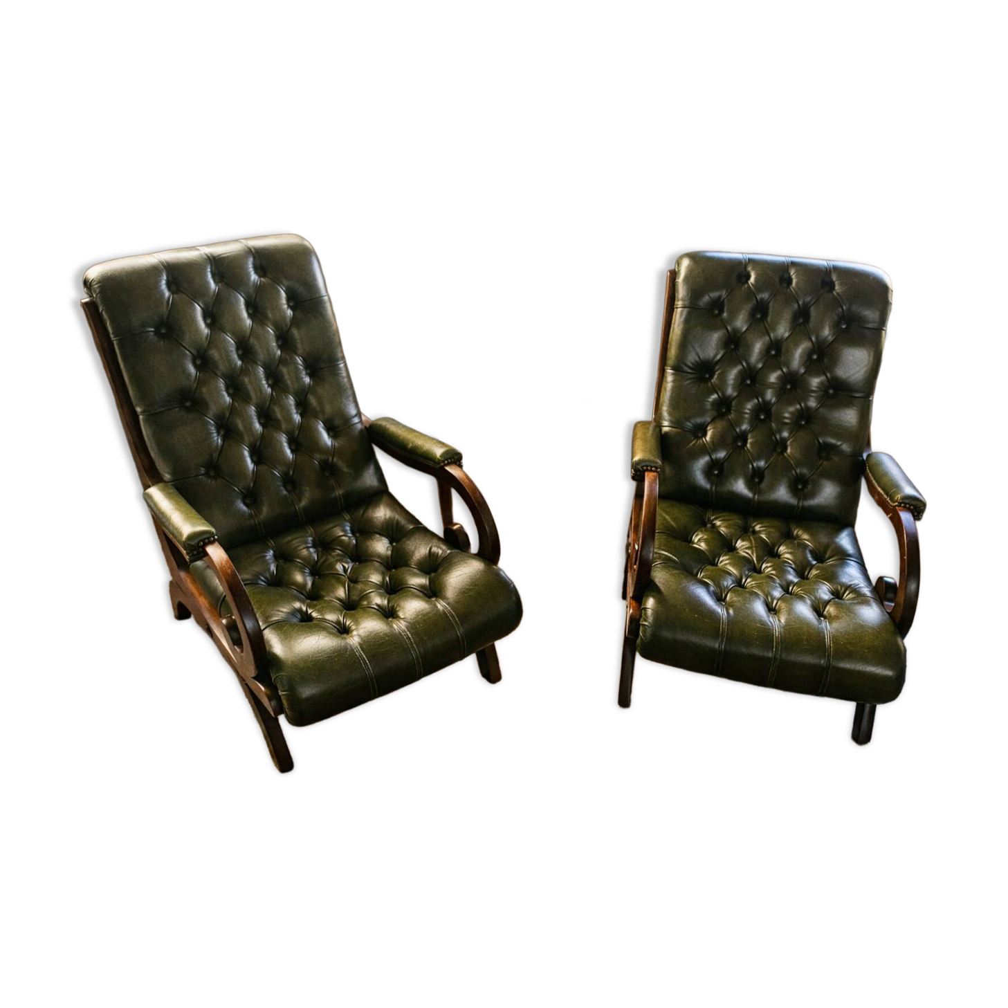 Pair of tufted leather armchairs in Chesterfield / English club style.