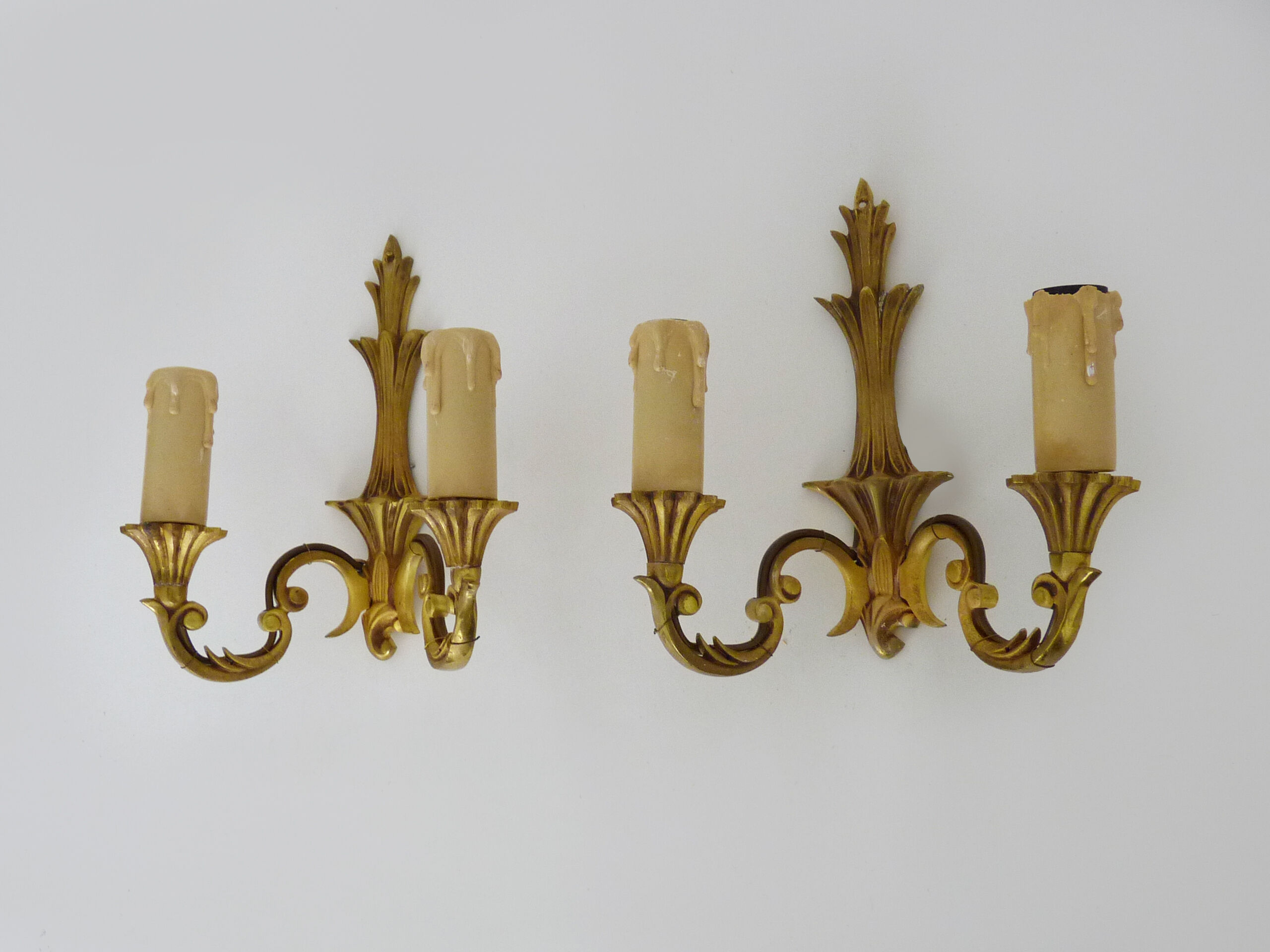 Old pair of wall sconces with double fires in bronze, seventies