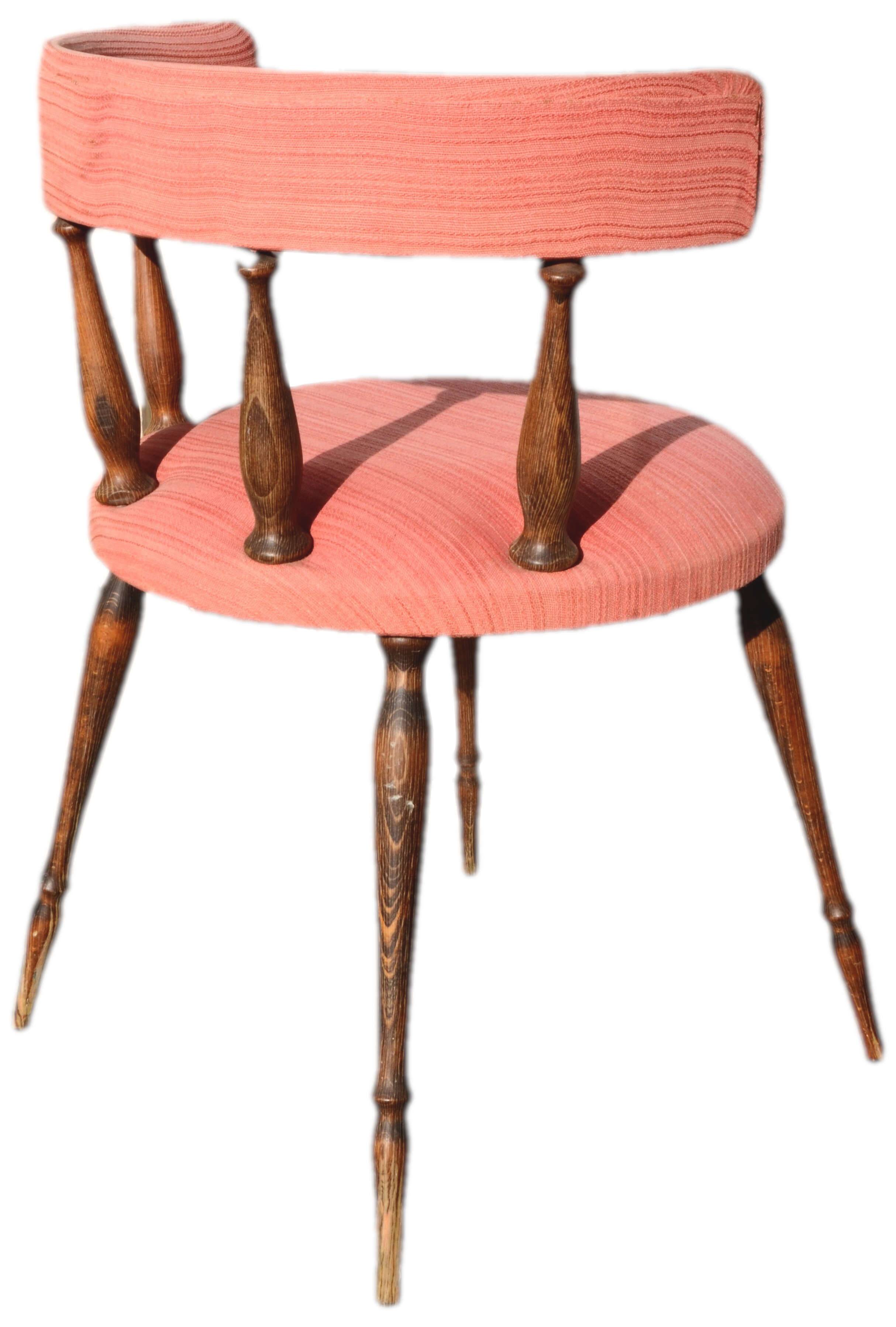 Pink gondola armchair in the style of Helmut.