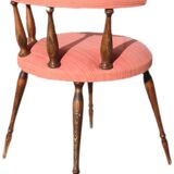 Pink gondola armchair in the style of Helmut.