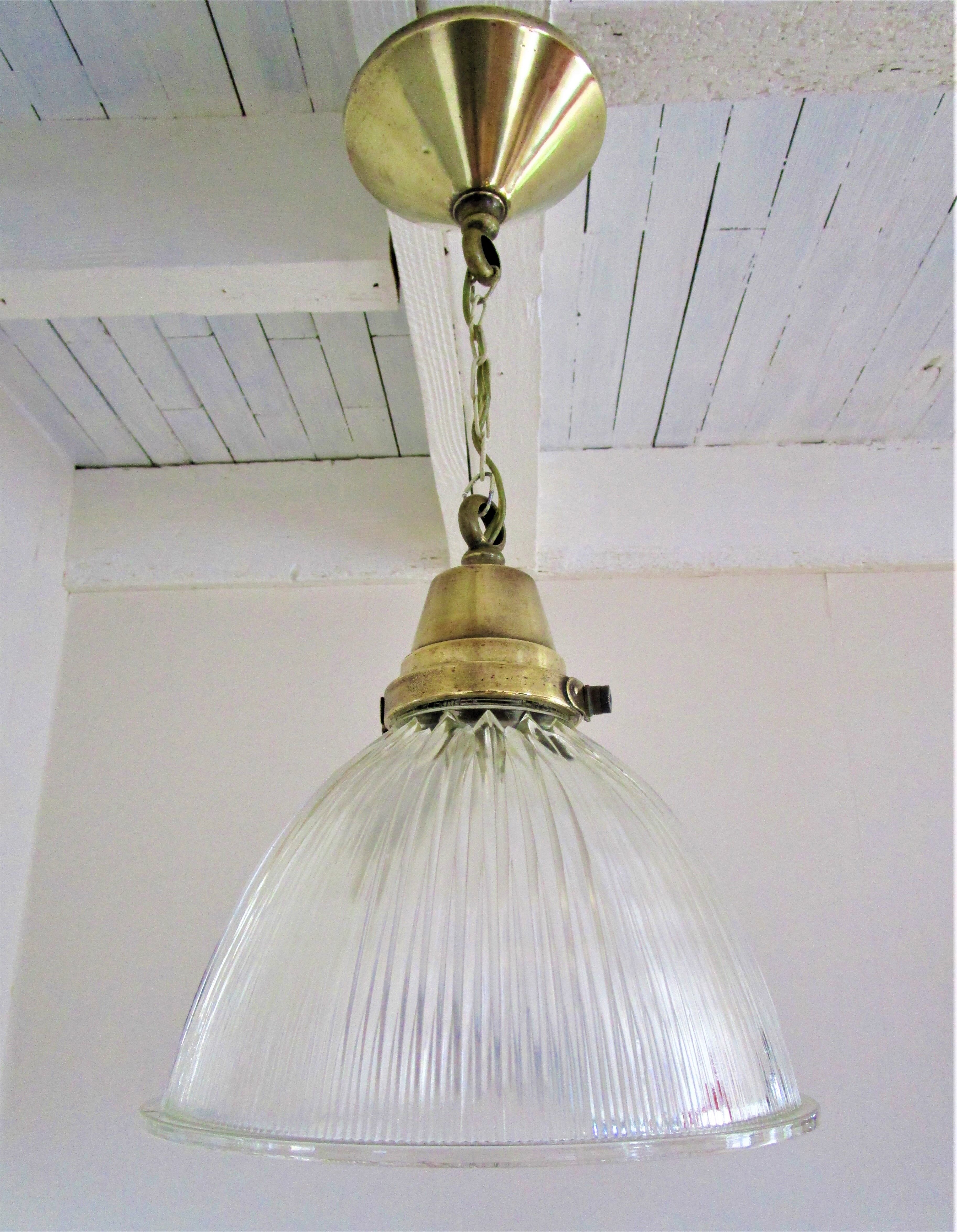Holophane glass suspension and vintage patinated brass