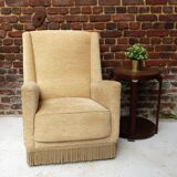 Fauteuil en velour beige et franges