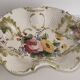 Openwork ceramic bowl with raised flower decoration in Italian style.
