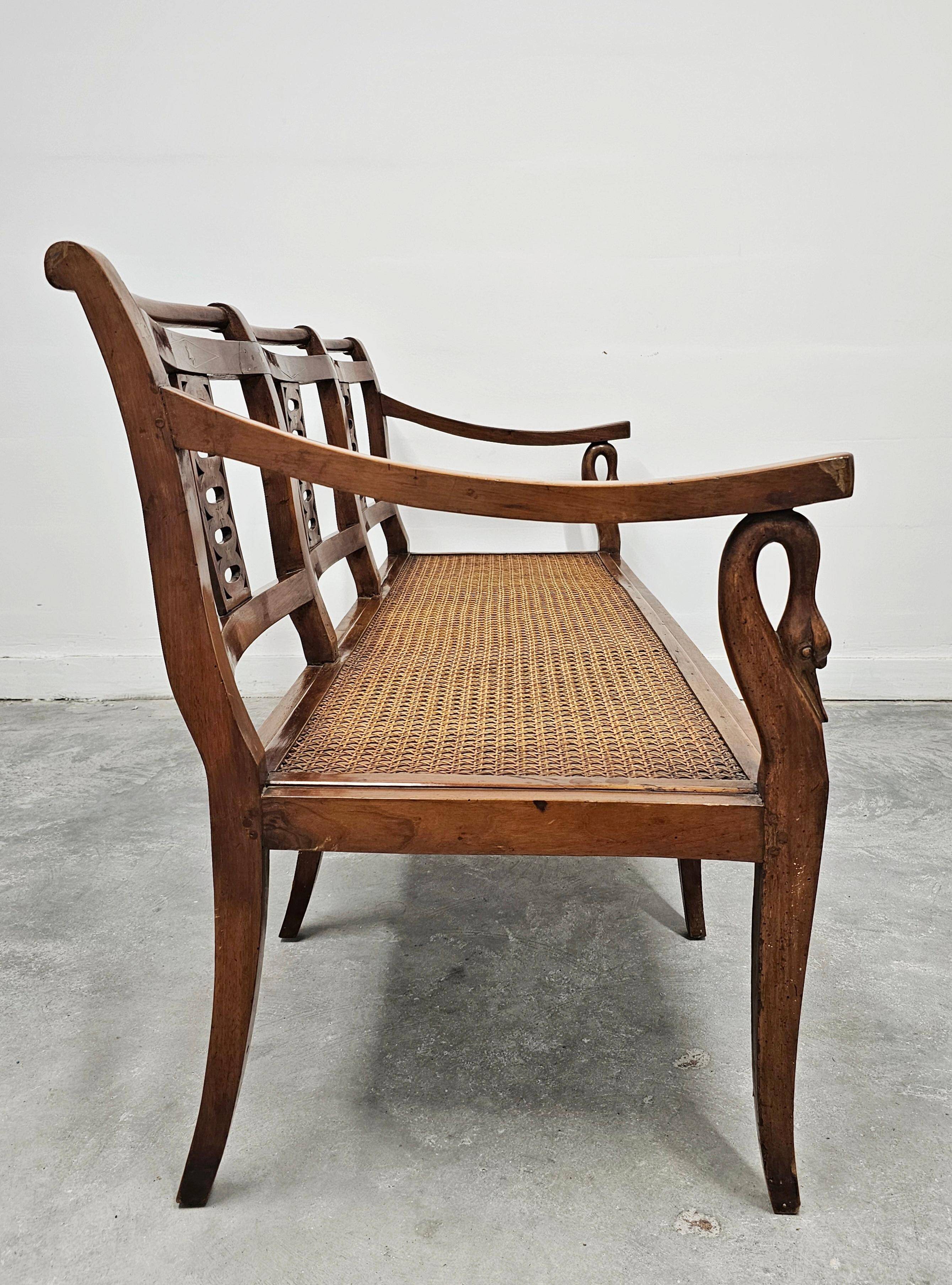 Directoire canapé in walnut with brass inlays, late 18th century.