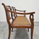 Directoire canapé in walnut with brass inlays, late 18th century.