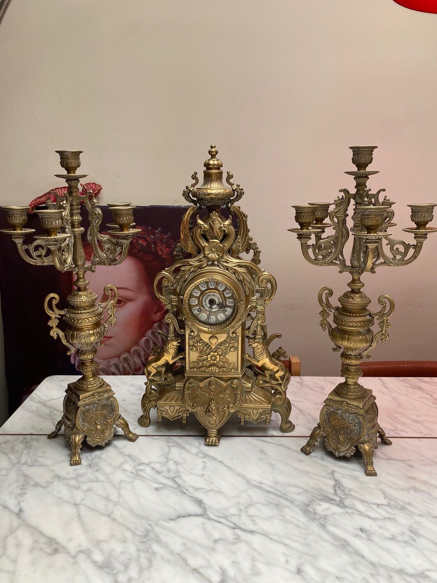 Fireplace trim clock and adornment of antique bronze candelabra