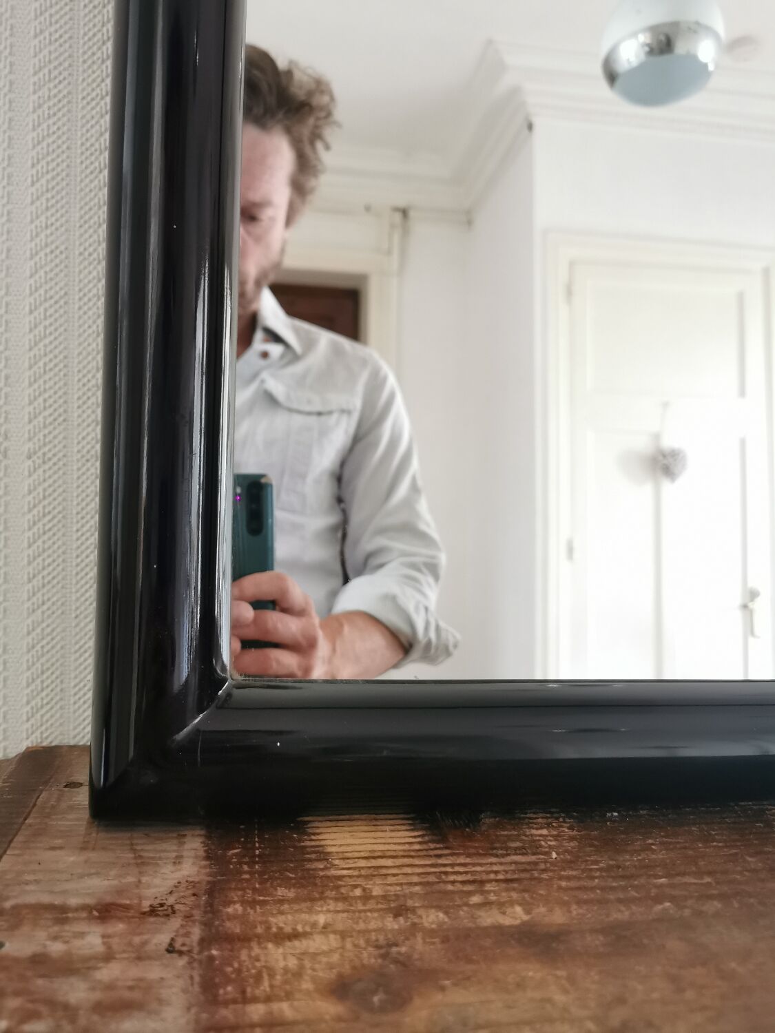 Large black lacquered mirror 1970