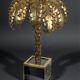 Gold metal palm lamp with glass plate base in 70s style