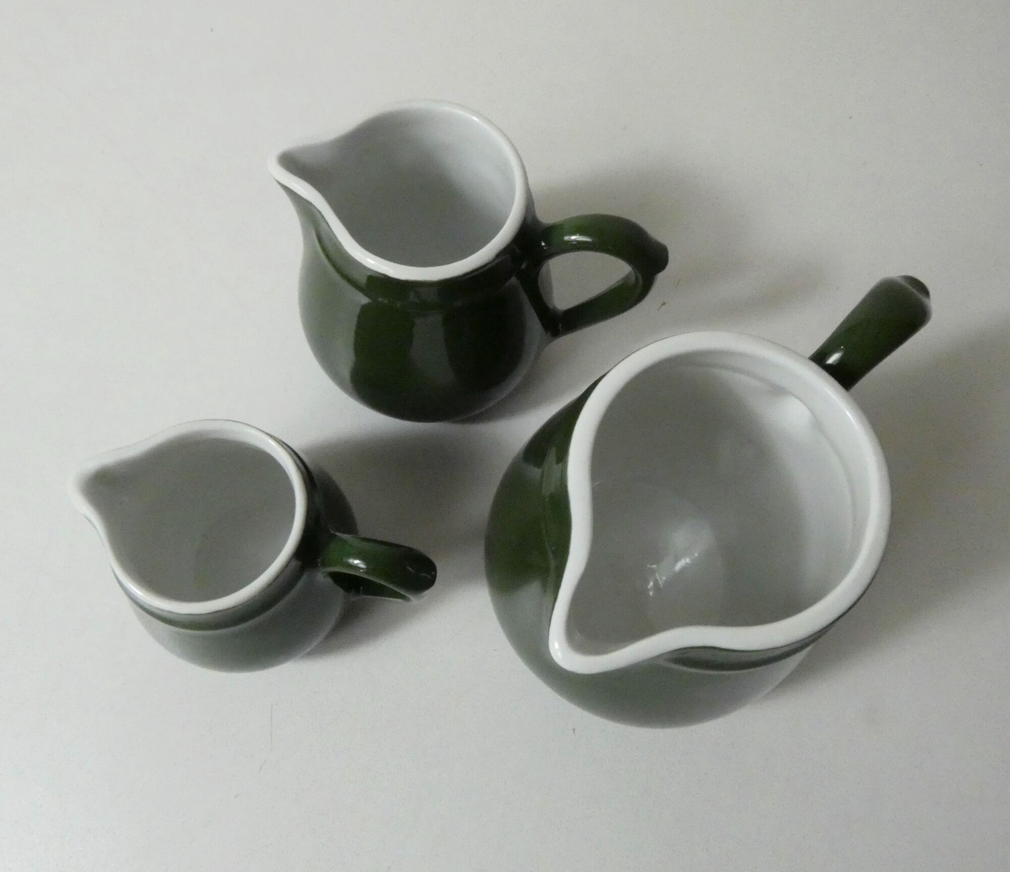 Trio of vintage bistro milk pots pilivite