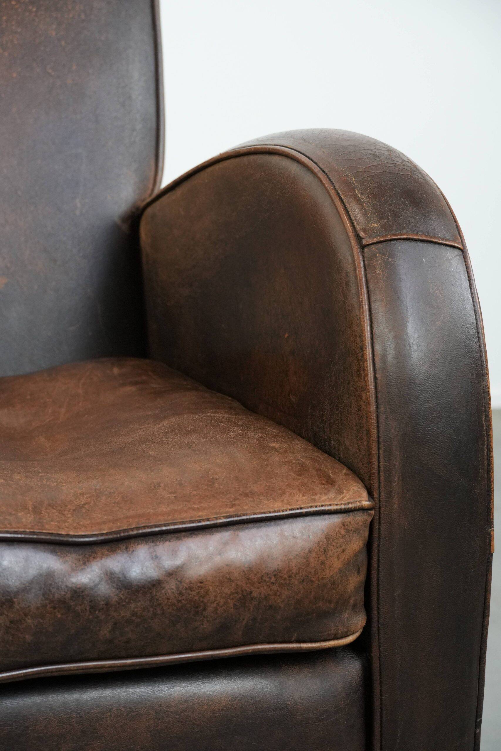 Vintage sheepskin leather design armchair in a dark cognac colour