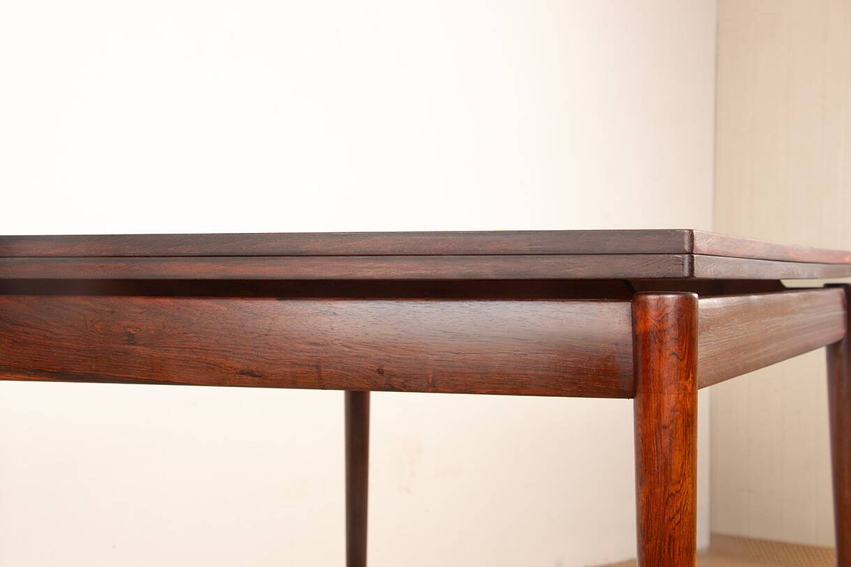 Danish extendable dining table in rosewood and brass by Poul Volther