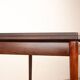 Danish extendable dining table in rosewood and brass by Poul Volther