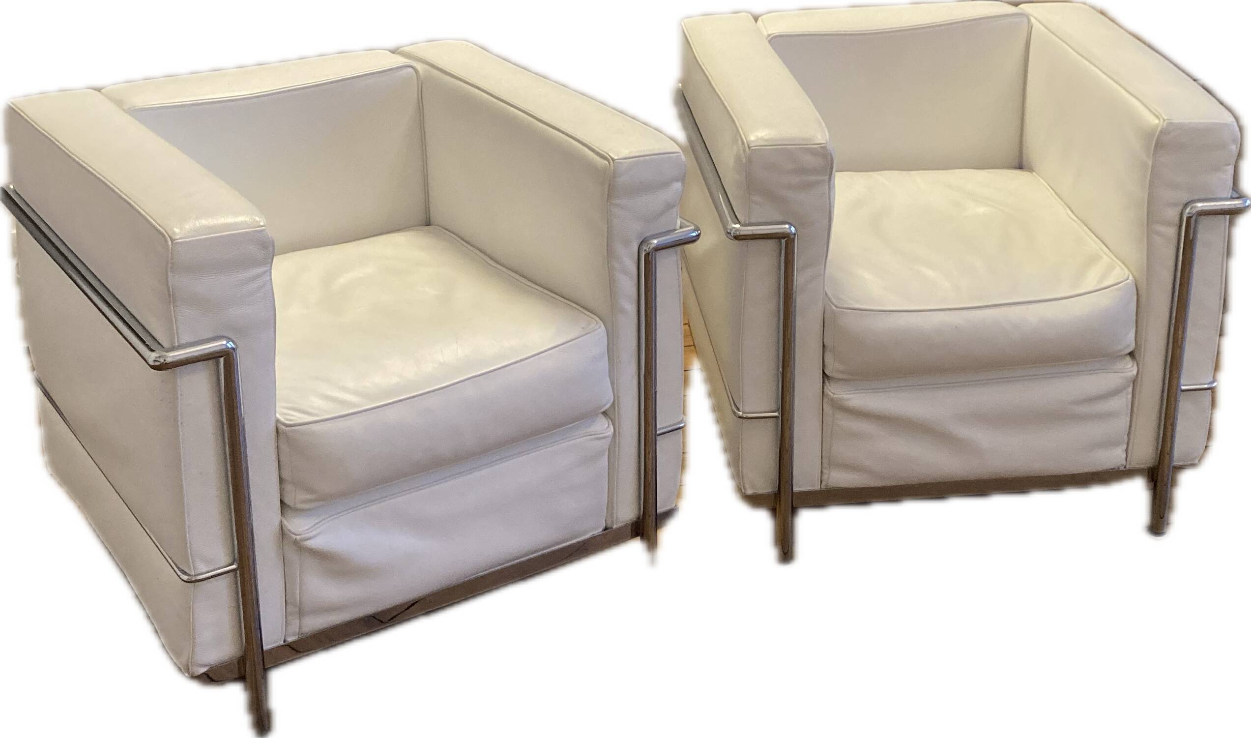 Pair of white leather and chrome armchairs