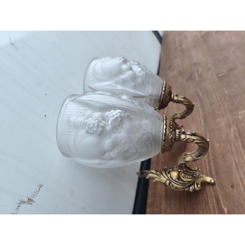Pair of brass wall lights and glass paste.