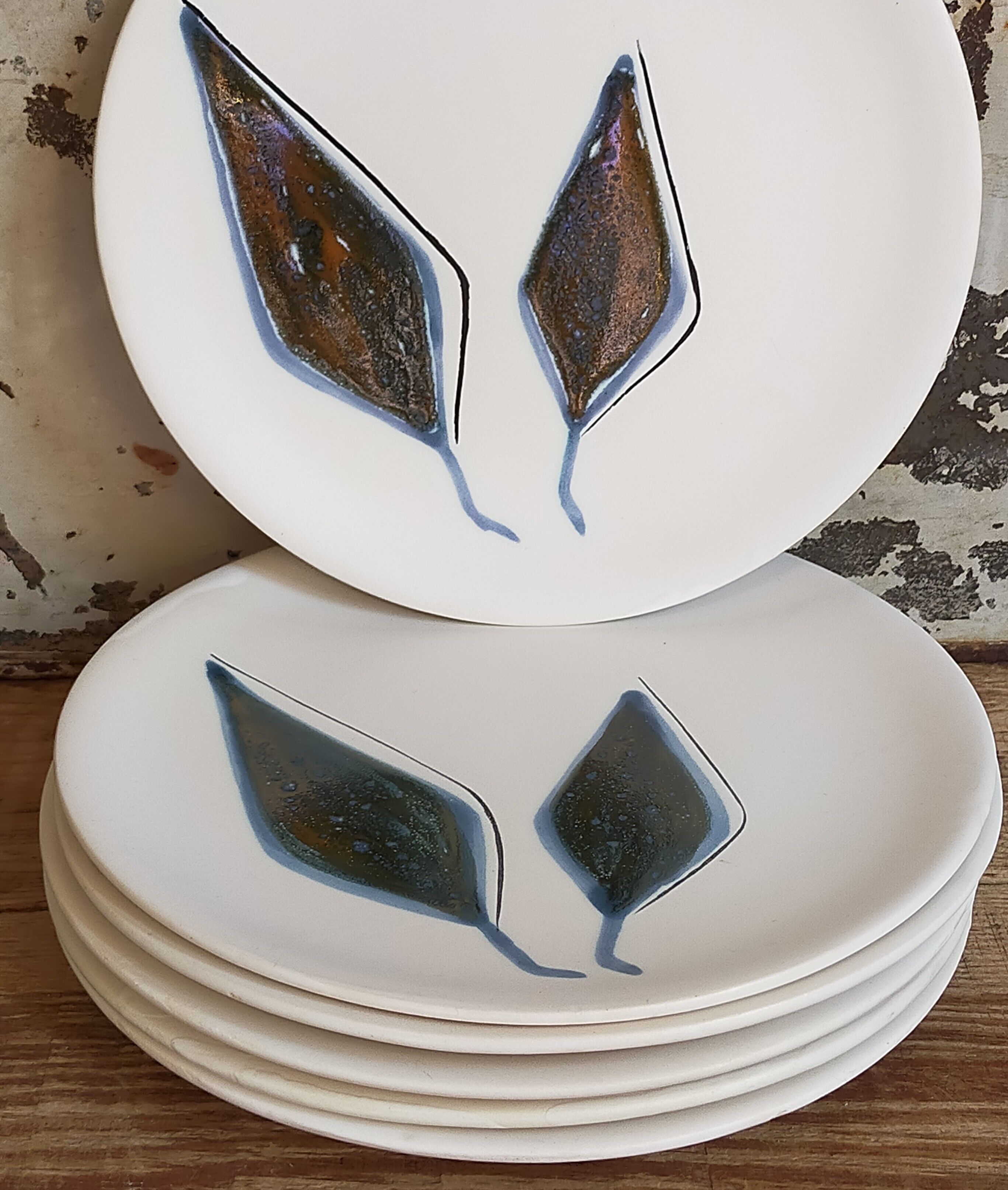 Six ceramic plates with matt enamel 50s