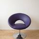Vintage 70s armchair in purple faux leather with steel legs.