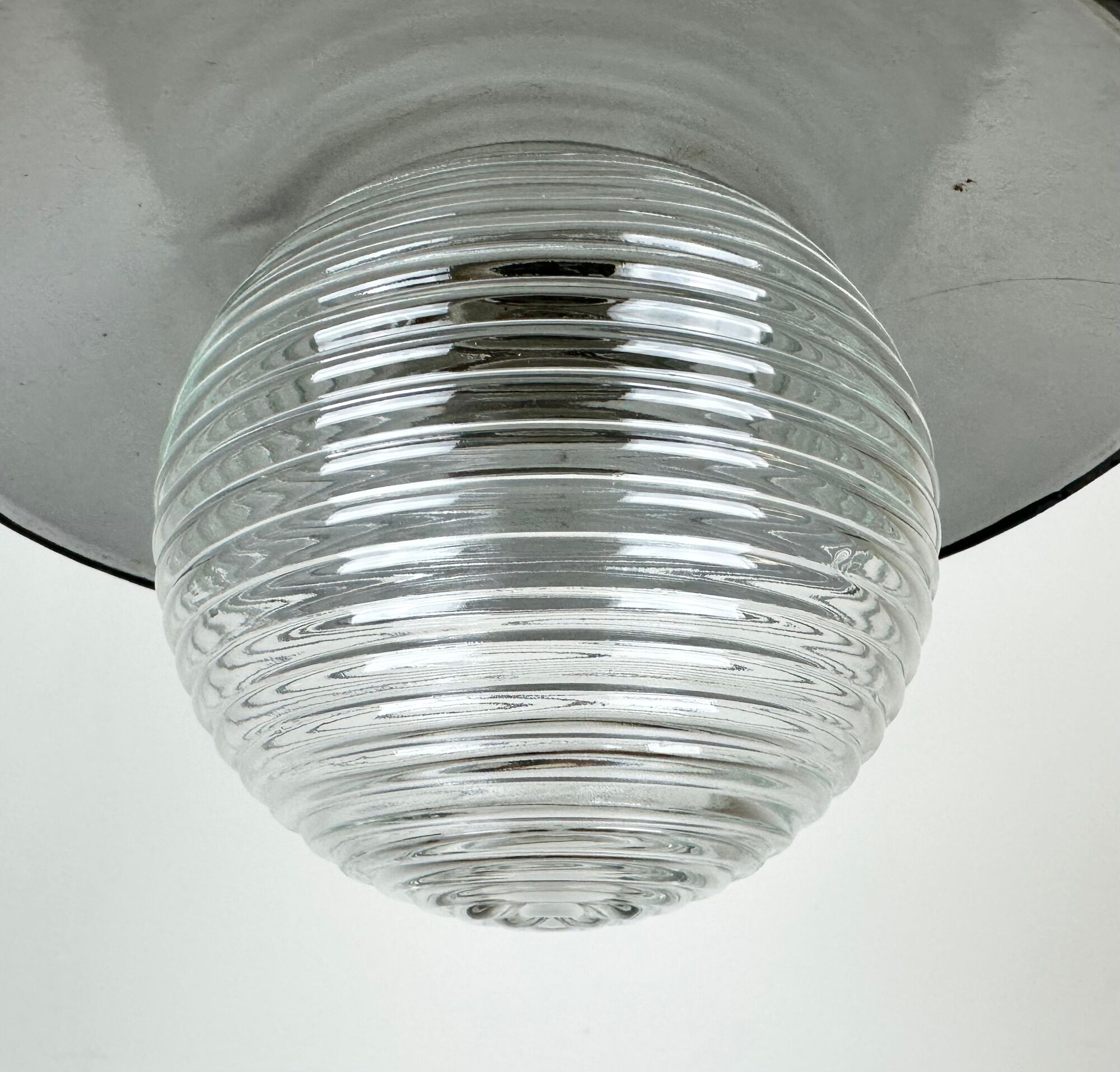 Industrial porcelain red enamel pendant light with ribbed clear glass, 1970s