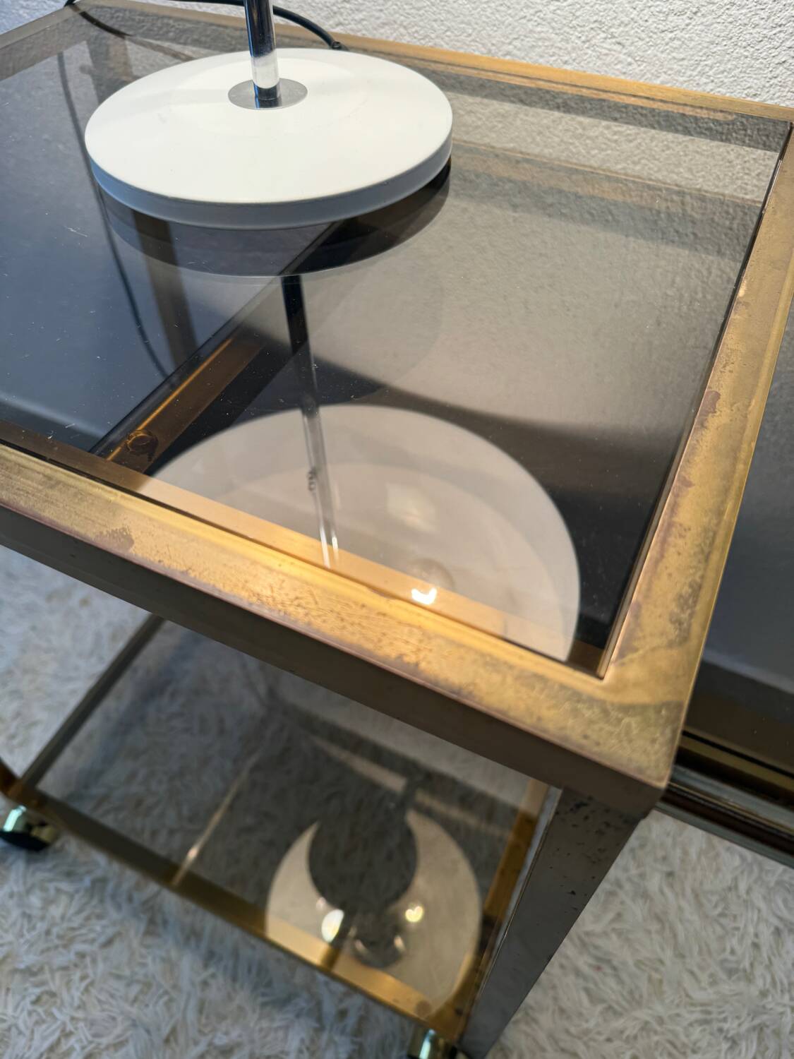 Brass rolling trolley with smoked glass from the 70s