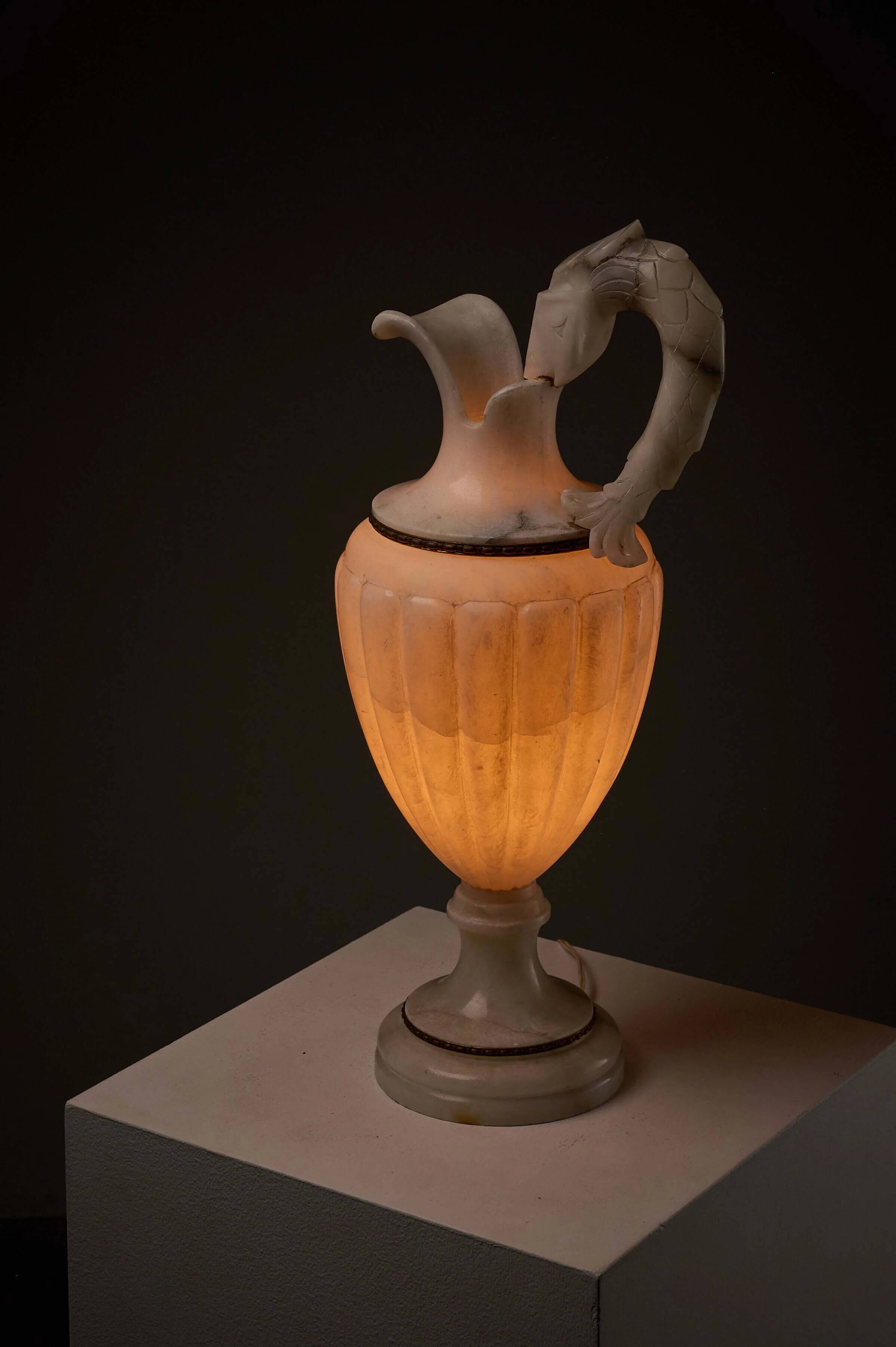 Carved alabaster urn lamp with stylized fish handle