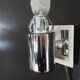 Transparent and white glass torch-type wall light.