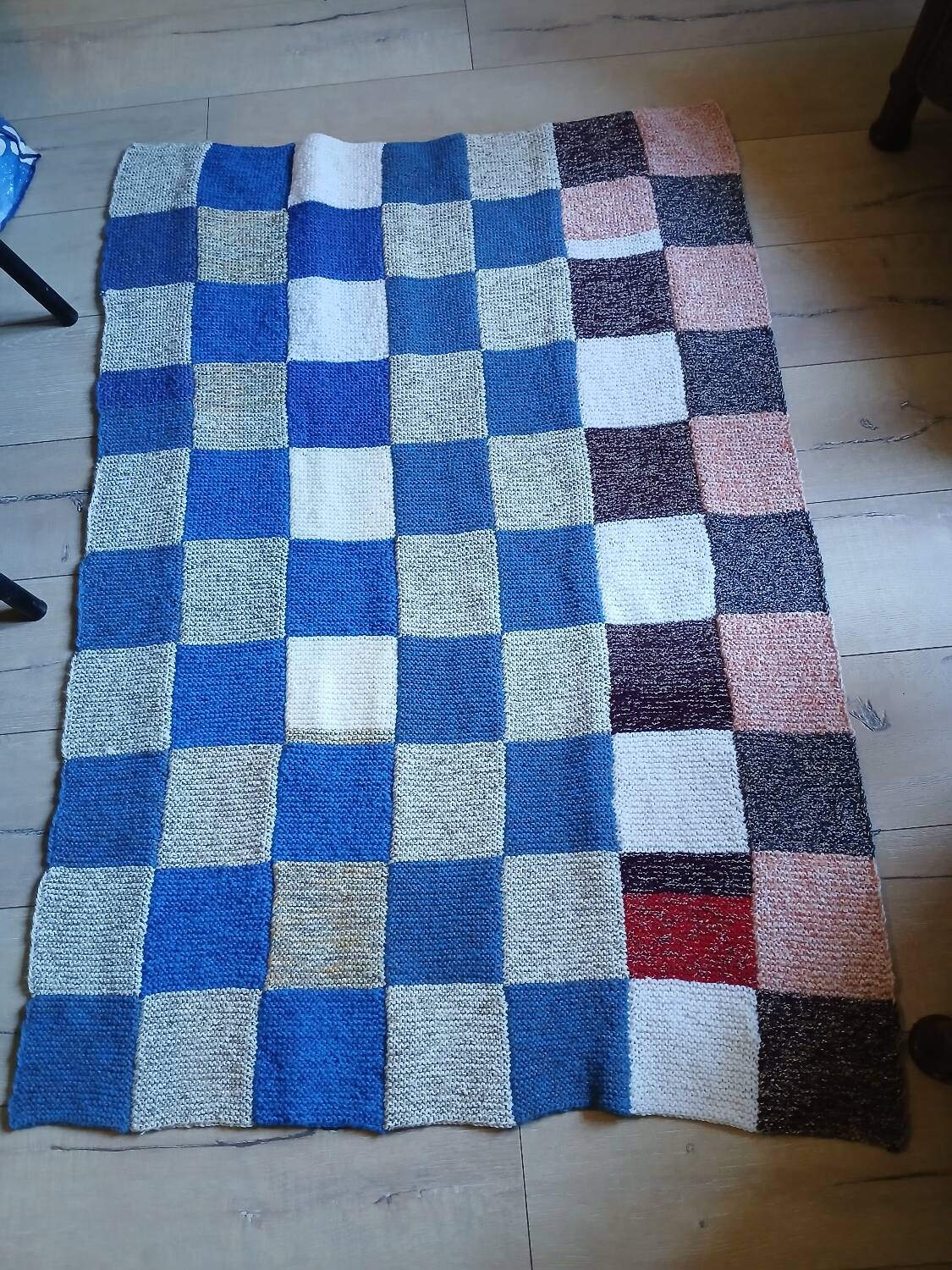 Hand knitted patchwork plaid