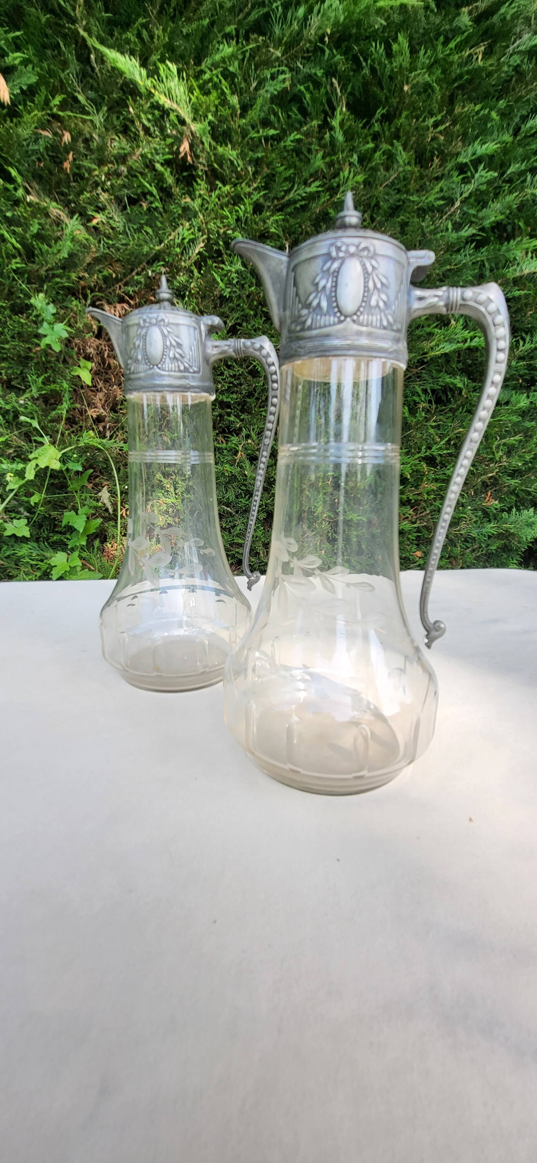 Pair of crystal and pewter jugs