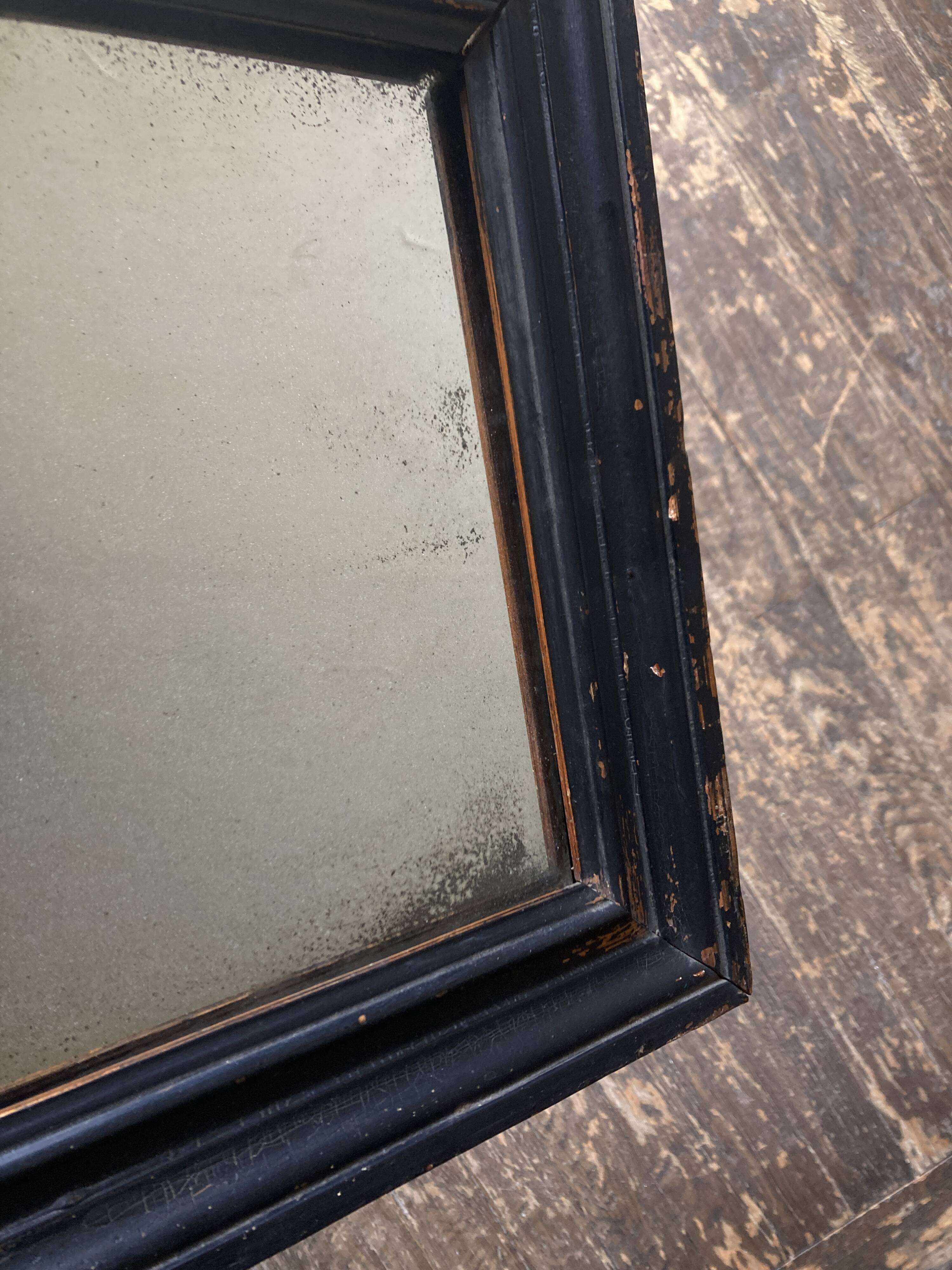 19th century blackened mirror with pitted glass 34cm x 40cm