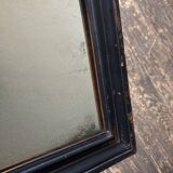 19th century blackened mirror with pitted glass 34cm x 40cm