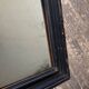19th century blackened mirror with pitted glass 34cm x 40cm