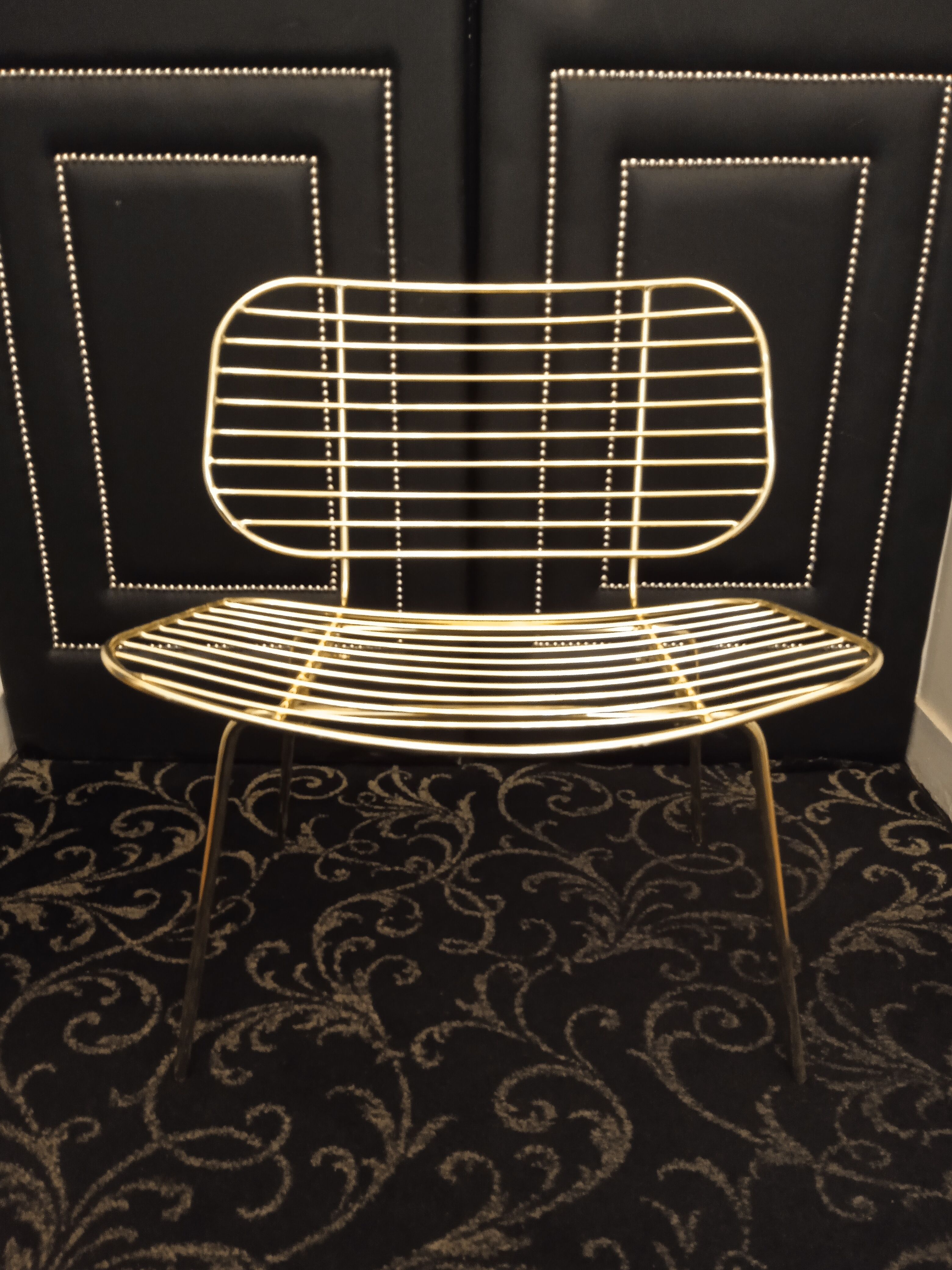 Designer gold wire armchair with cowhide cushion