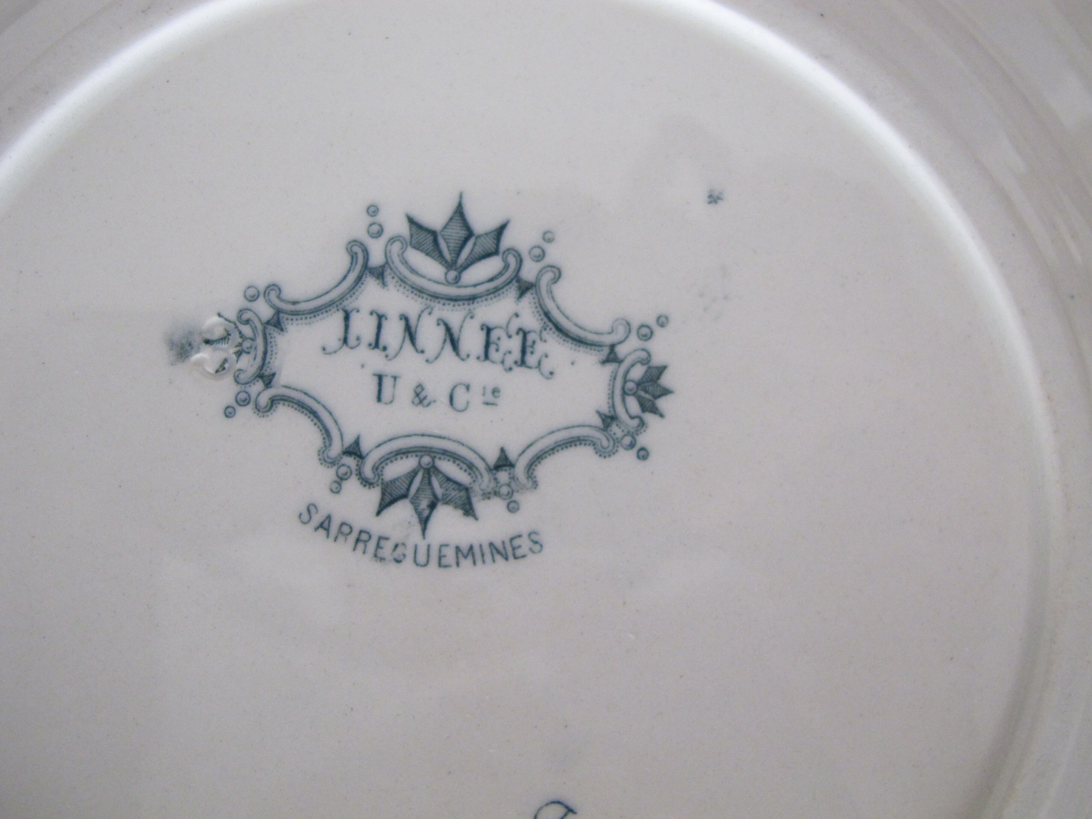 Set of 4 hollow plates in Iron Earth of Sarreguemines, model "Linnée".