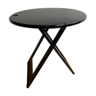 Black wooden folding table by Adrian Reed
