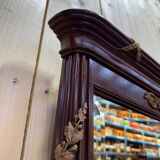 Louis XVI style mirror in mahogany and gold.