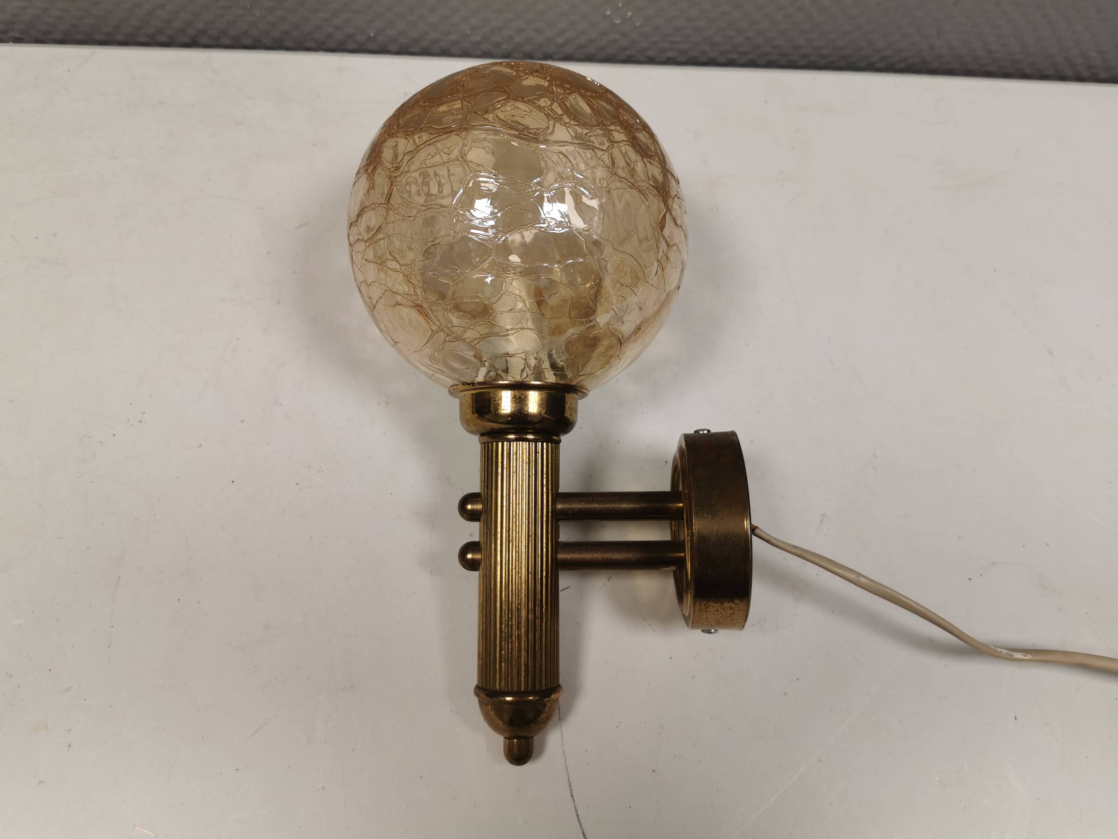 Older wall lamp in metal, brass and “cracked” glass.