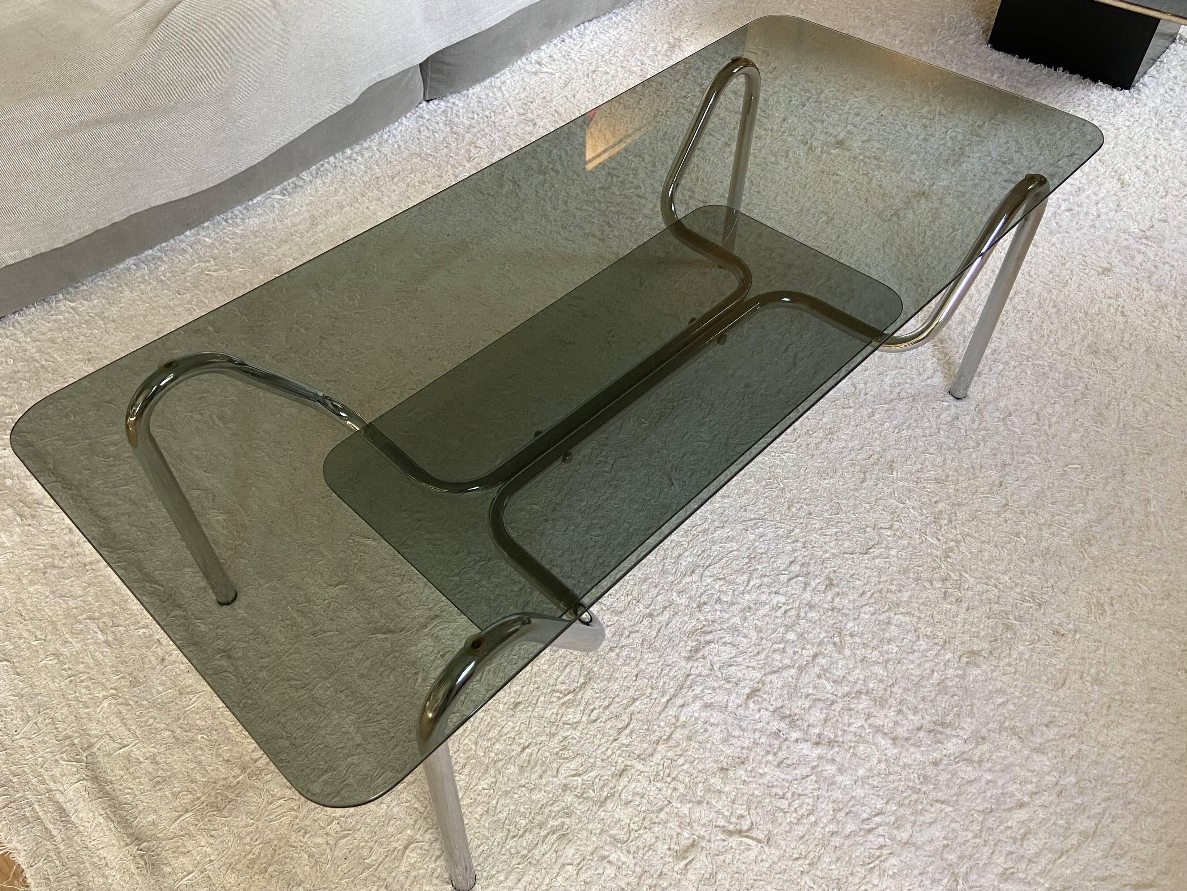 Double top coffee table in smoked glass and tubular structure in chromed steel