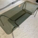 Double top coffee table in smoked glass and tubular structure in chromed steel